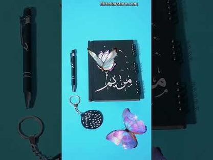 عرض نوت بوك وقلم وميدالية نصفين (ديزاين الفراشة)